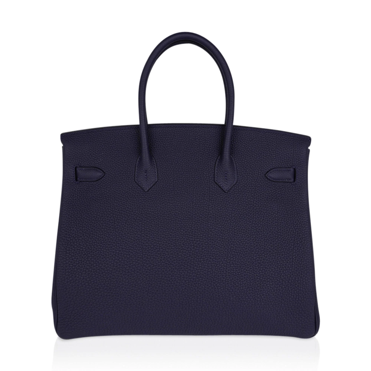 Saturated Midnight Navy Soft Subtle Pebbled Grain Roomy Structured Hand Tote With Seamless Uniform Stitching, Polished Golden Twist Lock Hardware And Matching Suspended Textured Tag Striped Metal Padlock Charm