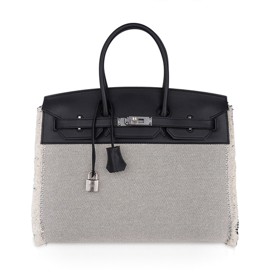 Two-Tone Dark Black And Off-White Woven Fringe Trim Roomy Structured Hand Tote With Brushed Silvery Twist Lock Hardware, Solid Dark Suspended Decorative Tag And Lined Metal Padlock Charm
